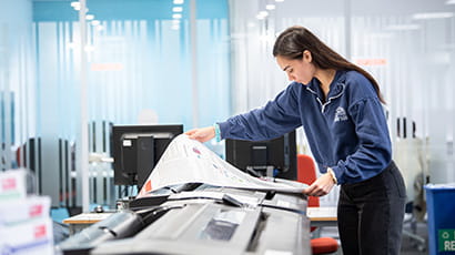 Student using a large format printer