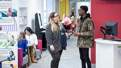 Staff and student talking at Glenside Library