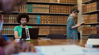 Students looking at law books