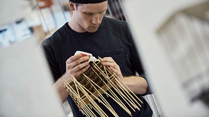 Architecture student building a small model.