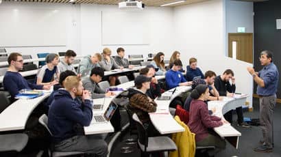 Group of students in a lecture hall. 