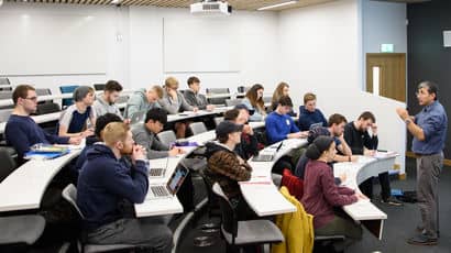 Group of students in a lecture hall. 