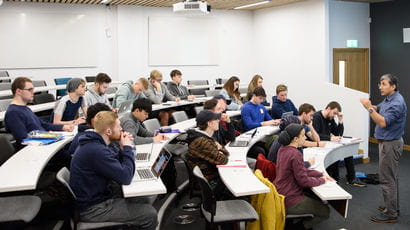 Group of students in a lecture hall.
