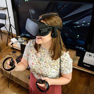 Person using a virtual reality (VR) headset in a room.
