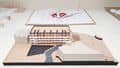 Building and landscape models using different materials such as plastic, cardboard, and paper.