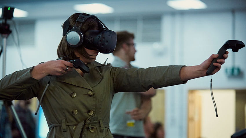 People playing and testing virtual reality devices