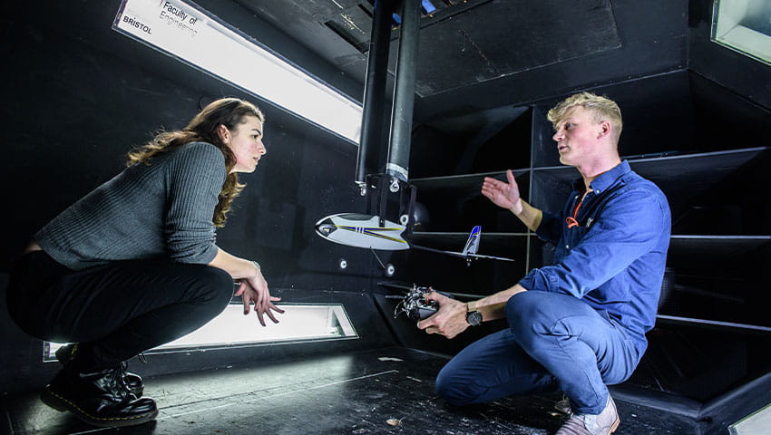 Students testing wind tunnel