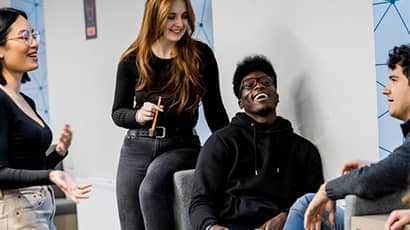 A group of students having a joyful conversation.