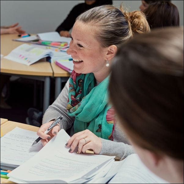 Group of students working at a table.