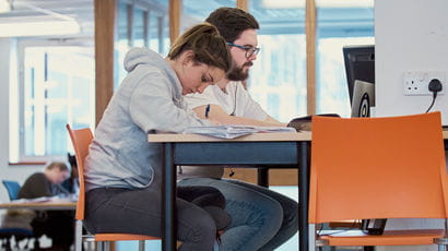 Students using computers in the library.