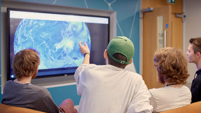Group of students working together in a study room.