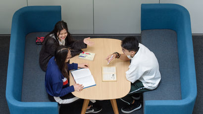 Group of students sitting in a break-out area
