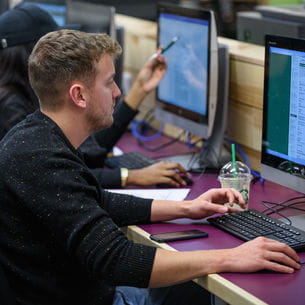 Student using a computer in the library.