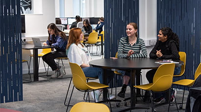 Students talking in The Works study space on Frenchay Campus.