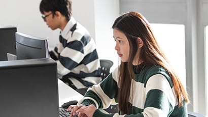 Students working on desktop computers