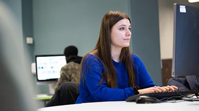 Student working on a desktop computer