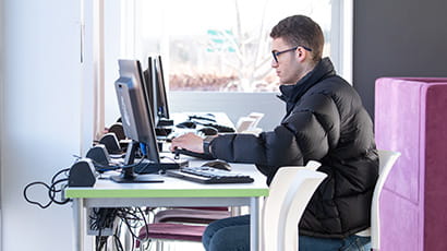 Student working on a desktop computer