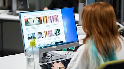 Student working on a desktop computer