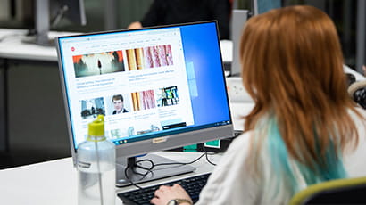 Student working on a desktop computer