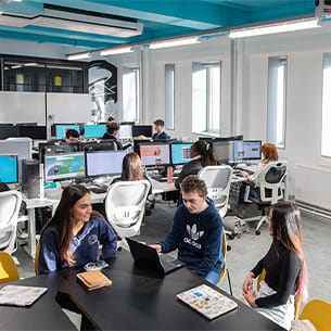 A group of students seated in a social study space in The Works.