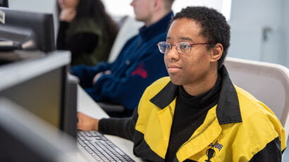 Students working on computers in the library.