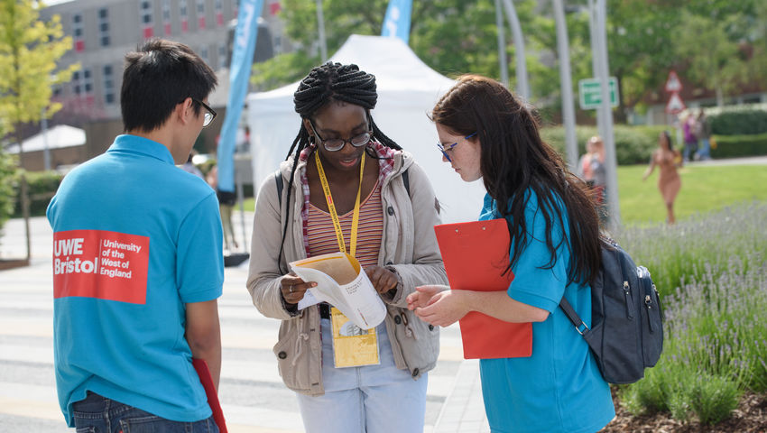 student ambassadors talking to a visitor