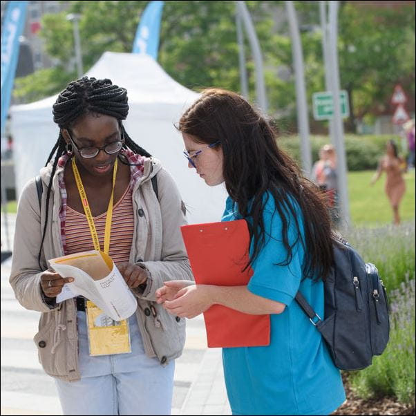 Student ambassador talking to a visitor